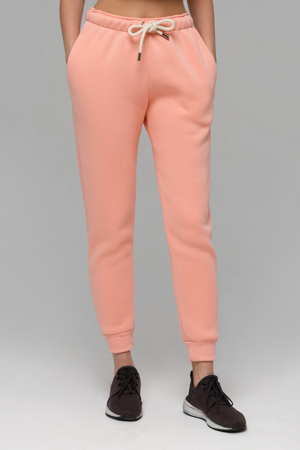 Джоггеры женские утепленные персиковый розовый цвет купить спортивные брюкис начесом из футера в Магазине Толстовок модель унисекс